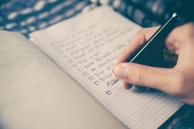 A person making SEO checklist which should be fulfilled by WordPress Theme